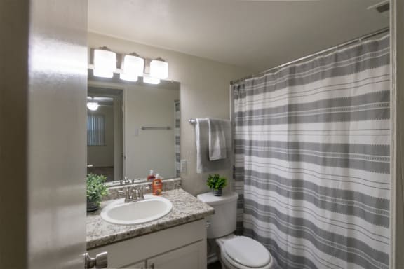 This is a photo of the primary bathroom in the 970 square foot 2 bedroom, 2 bath apartment at Preston Park Apartments in Dallas, TX
