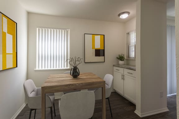 This is a photo of a virtually staged dining room room in the 970 square foot 2 bedroom, 2 bath apartment at Preston Park Apartments in Dallas, TX