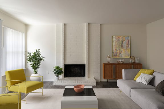 This is a photo of a virtually staged living room room in the 970 square foot 2 bedroom, 2 bath apartment at Preston Park Apartments in Dallas, TX