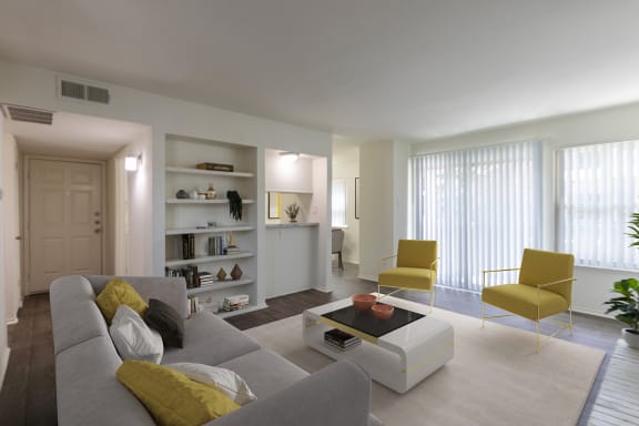 This is a photo of a virtually staged living room room in the 970 square foot 2 bedroom, 2 bath apartment at Preston Park Apartments in Dallas, TX
