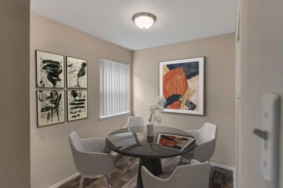 This is a photo of a virtually staged dining room in the 650 square foot 1 bedroom, 1 bath apartment at Preston Park Apartments in Dallas, TX.