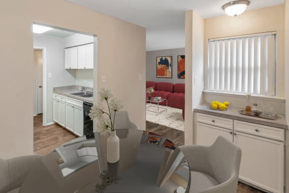 This is a photo of a virtually staged dining room in the 650 square foot 1 bedroom, 1 bath apartment at Preston Park Apartments in Dallas, TX.