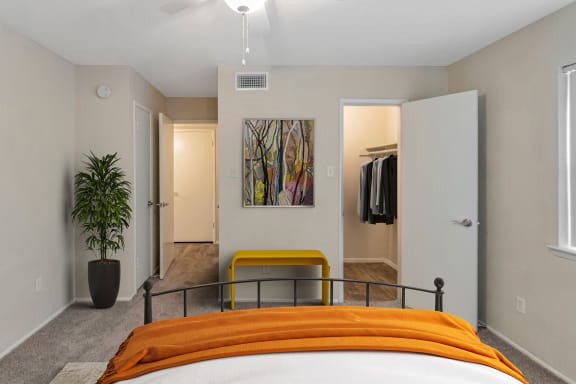 This is a photo of a virtually staged bedroom in the 650 square foot 1 bedroom, 1 bath apartment at Preston Park Apartments in Dallas, TX.