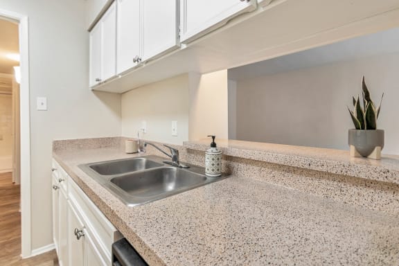 This is a photo of the kitchen in the 650 square foot 1 bedroom, 1 bath apartment at Preston Park Apartments in Dallas, TX