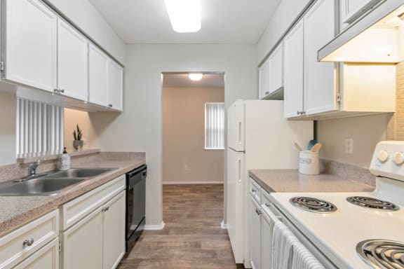 This is a photo of the kitchen in the 650 square foot 1 bedroom, 1 bath apartment at Preston Park Apartments in Dallas, TX