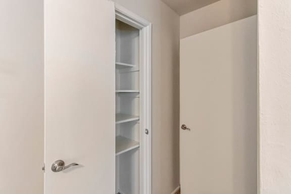 This is a photo of the one of the bedroom closets in the 650 square foot 1 bedroom, 1 bath apartment at Preston Park Apartments in Dallas, TX