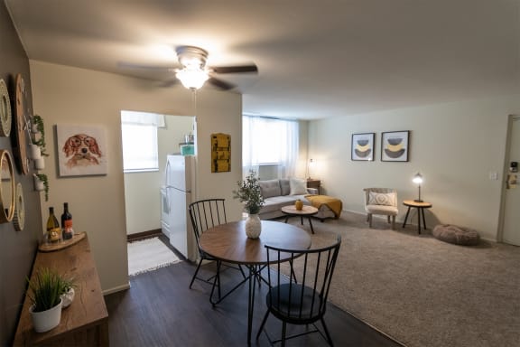 This is a picture of the dining area and living room in a 576 sq foot 1 bedroom, 1 bath apartment at Red Bank Reserve in the Madisonville neighborhood of Cincinnati, Ohio.