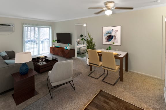 This is a photo of the digitally staged living room of a 742 square foot, 2 bedroom apartment at Romaine Court Apartments in the Oakley neighborhood of Cincinnati, Ohio.