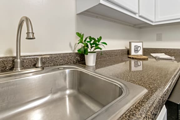 This is a photo of the kitchen of a 742 square foot, 2 bedroom apartment at Romaine Court Apartments in the Oakley neighborhood of Cincinnati, Ohio.