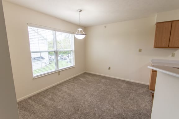 This is photo of the dining room in the 852 square foot, 1 bedroom Fairlawn floor plan at Trails of Saddlebrook Apartments in Florence, KY.