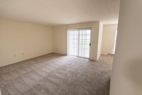 This is photo of the living room in the 852 square foot, 1 bedroom Fairlawn floor plan at Trails of Saddlebrook Apartments in Florence, KY.