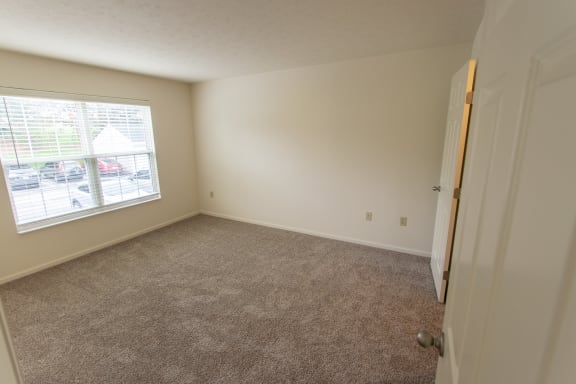 This is photo of the bedroom in the 852 square foot, 1 bedroom Fairlawn floor plan at Trails of Saddlebrook Apartments in Florence, KY.