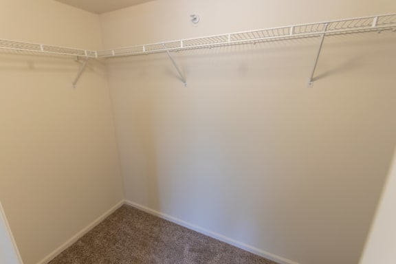 This is photo of the bedroom walk-in closet in the 852 square foot, 1 bedroom Fairlawn floor plan at Trails of Saddlebrook Apartments in Florence, KY.