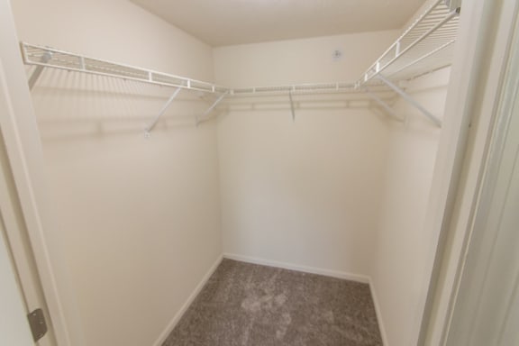 This is photo of the second bedroom walk-in closet in the 1056 square foot, 2 bedroom Gainsway floor plan at Trails of Saddlebrook Apartments in Florence, KY.