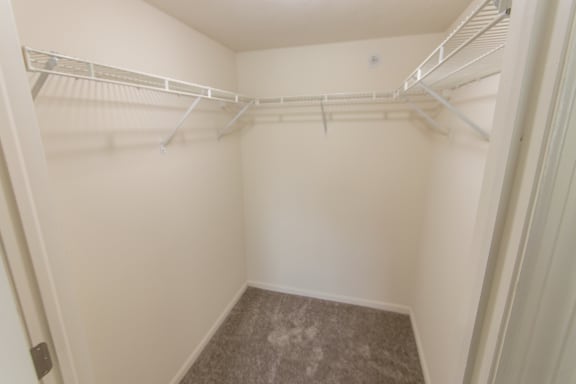 This is photo of the second bedroom walk-in closet in the 1056 square foot, 2 bedroom Gainsway floor plan at Trails of Saddlebrook Apartments in Florence, KY.