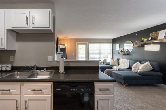 This is a photo of the living room from the kitchen in the 1226 square foot 3 bedroom, 2 bath Hambletonian at Trails of Saddlebrook Apartments in Florence, KY.