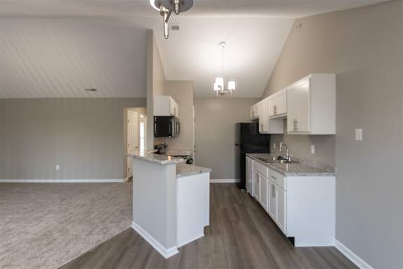 This is photo of the kitchen in the 852 square foot, 1 bedroom, 1 bath Fairlawn floor plan at Trails of Saddlebrook Apartments in Florence, KY.