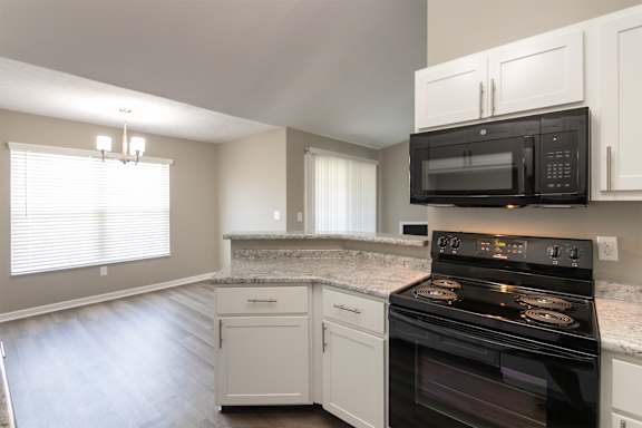 This is photo of the dining area kitchen in the 852 square foot, 1 bedroom, 1 bath Fairlawn floor plan at Trails of Saddlebrook Apartments in Florence, KY.