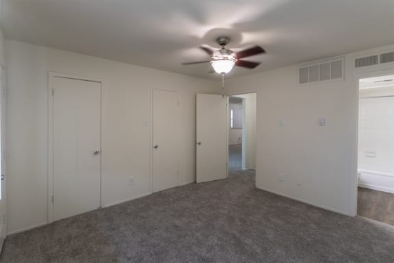 This is a photo of the primary bedroom in the 963 square foot 2 bedroom, 2 bath apartment at The Summit at Midtown Apartments in Dallas, TX.