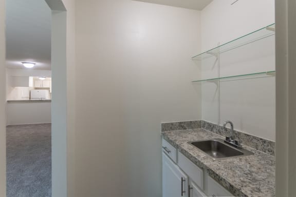 This is a photo of the wet bar in the 963 square foot 2 bedroom, 2 bath apartment at The Summit at Midtown Apartments in Dallas, TX.