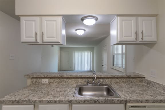 This is a photo of the kitchen in the 963 square foot 2 bedroom, 2 bath apartment at The Summit at Midtown Apartments in Dallas, TX.
