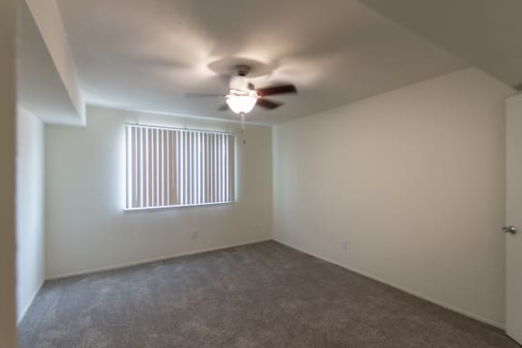 This is a photo of the second bedroom in the 963 square foot 2 bedroom, 2 bath apartment at The Summit at Midtown Apartments in Dallas, TX.