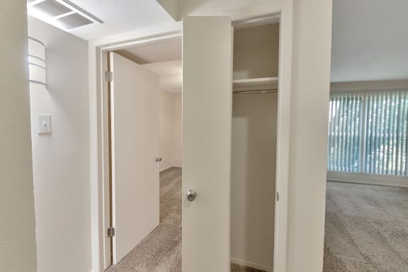 This is a photo of the one of two closets in the 558 square foot 1 bedroom apartment at The Summit at Midtown Apartments in Dallas, TX.