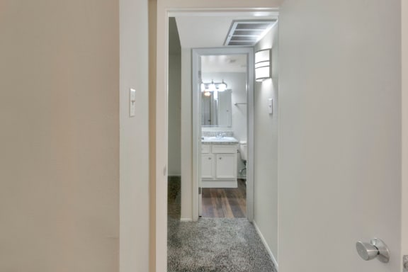 This is a photo of the hallway in the 558 square foot 1 bedroom apartment at The Summit at Midtown Apartments in Dallas, TX.