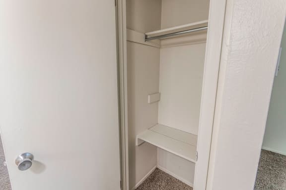 This is a photo of the one of the three closet in the 640 square foot 1 bedroom apartment at The Summit at Midtown Apartments in Dallas, TX.