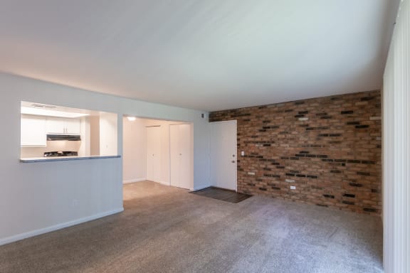 This is a photo of the living room in the 841 square foot, 2 bedroom, 1 bath with upgrade  floor plan at Village East Apartments in Franklin, OH.