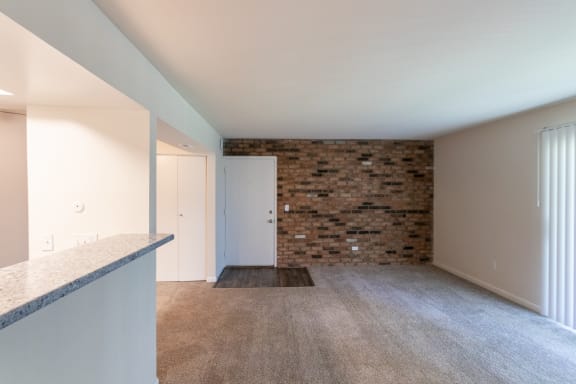 This is a photo of the living room in the 841 square foot, 2 bedroom, 1 bath with upgrade  floor plan at Village East Apartments in Franklin, OH.