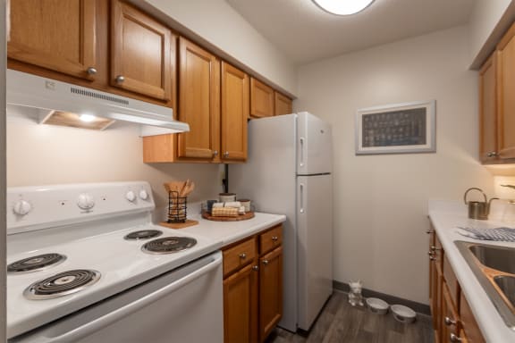 White Cabinetry And Appliances In Kitchen