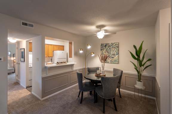 This is a photo of the dining area from the living room in the 822 square foot, 2 bedroom, 1 bath floor plan at Village East Apartments in Franklin, OH.