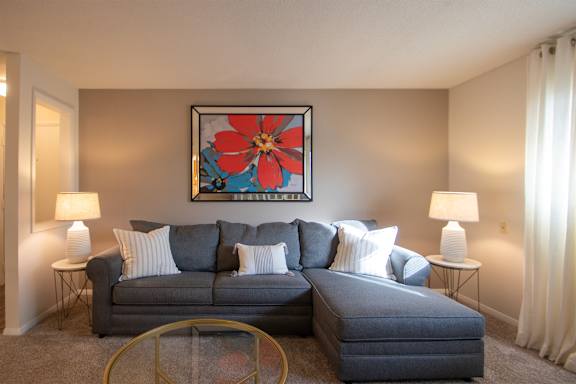 This is a photo of the living room in the 822 square foot, 2 bedroom, 1 bath floor plan at Village East Apartments in Franklin, OH.