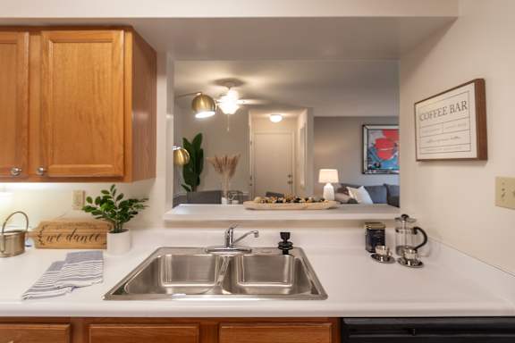 This is a photo of the living area from the kitchen in the 822 square foot, 2 bedroom, 1 bath floor plan at Village East Apartments in Franklin, OH.