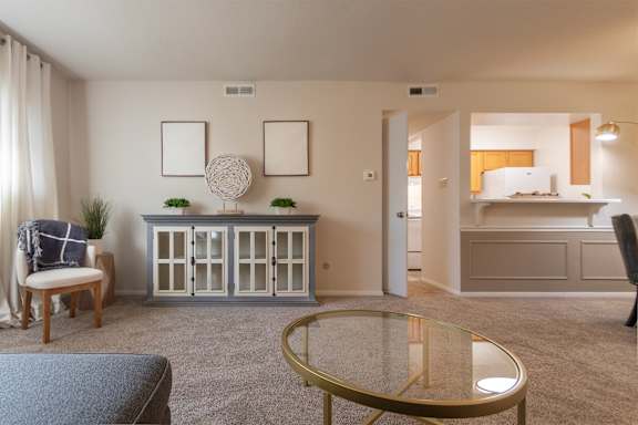This is a photo of the living room in the 822 square foot, 2 bedroom, 1 bath floor plan at Village East Apartments in Franklin, OH.