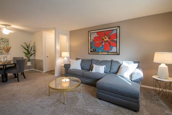 This is a photo of the living room in the 822 square foot, 2 bedroom, 1 bath floor plan at Village East Apartments in Franklin, OH.