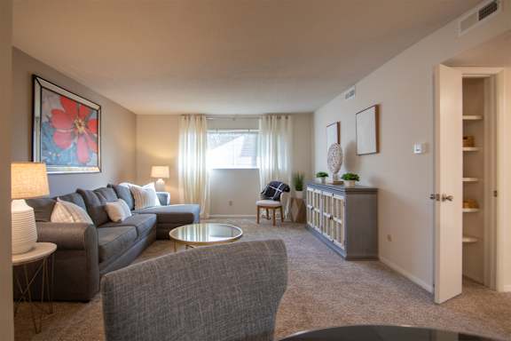 This is a photo of the living room in the 822 square foot, 2 bedroom, 1 bath floor plan at Village East Apartments in Franklin, OH.