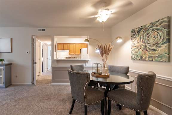 This is a photo of the kitchen from the dining room in the 822 square foot, 2 bedroom, 1 bath floor plan at Village East Apartments in Franklin, OH.