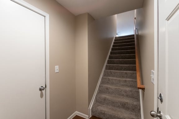 This is a photo of the stairs to the second floor in the 1170 square foot 2 bedroom, 2 bath Freedom Balcony at Washington Place Apartments in Miamisburg, Ohio in Washington Township.
