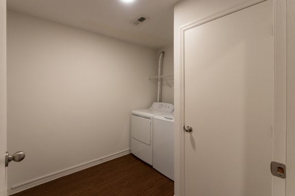 This is a photo of the utility room with full siize washer and dryer in the 1170 square foot 2 bedroom, 2 bath Freedom Balcony at Washington Place Apartments in Miamisburg, Ohio in Washington Township.