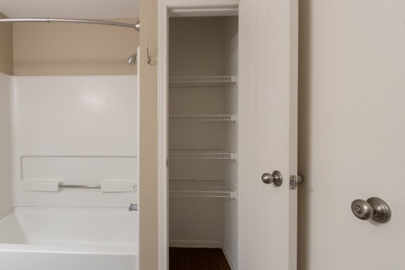 This is a photo of the linen closet in the primary bathroom in the 1170 square foot 2 bedroom, 2 bath Freedom Balcony at Washington Place Apartments in Miamisburg, Ohio in Washington Township.