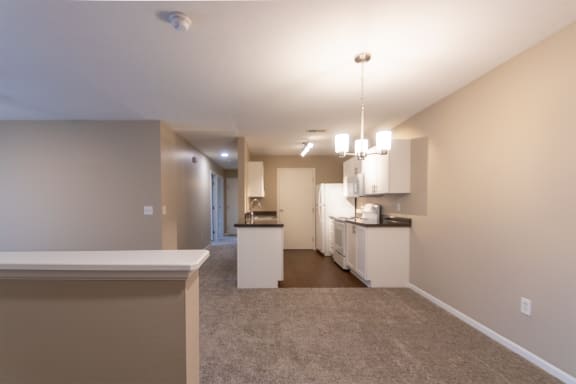 This is a photo of the dining area and kitchen in the 1040 square foot 2 bedroom, 1 bath Patriot at Washington Place Apartments in Miamisburg, Ohio in Washington Township.
