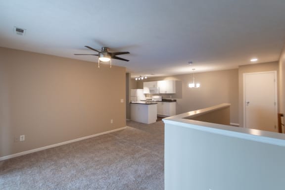 This is a photo of the kitchen and dining area from the living room in the 1040 square foot 2 bedroom, 1 bath Patriot at Washington Place Apartments in Miamisburg, Ohio in Washington Township.