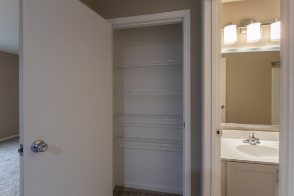 This is a photo of the hall linen closet in the 1040 square foot 2 bedroom, 1 bath Patriot at Washington Place Apartments in Miamisburg, Ohio in Washington Township.