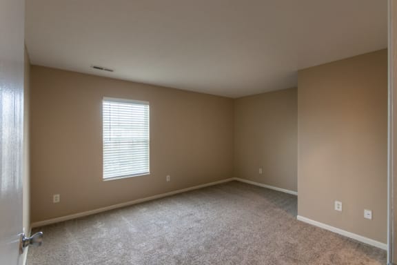This is a photo of the primary bedroom in the 1040 square foot 2 bedroom, 1 bath Patriot at Washington Place Apartments in Miamisburg, Ohio in Washington Township.