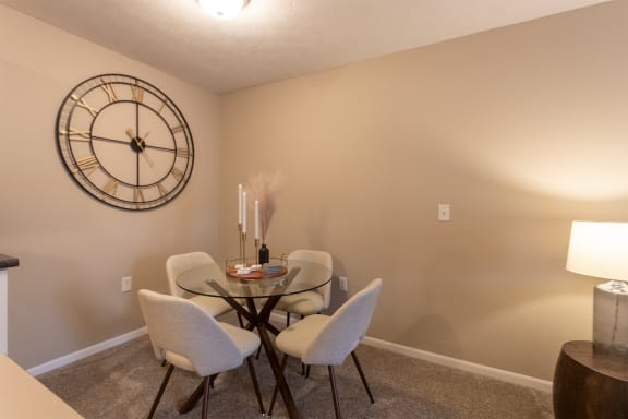 This is a photo of the dining room of the 890 square foot 2 bedroom, 2 bath Liberty at Washington Place Apartments in in Miamisburg, Ohio in Washington Township.