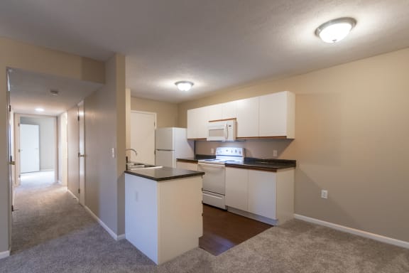 This is a photo of the kitchen and hallway in the 890 square foot 2 bedroom, 1 bath Liberty (lower) at Washington Place Apartments in Miamisburg, Ohio in Washington Township.