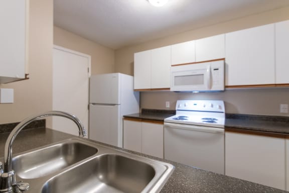 This is a photo of the kitchen in the 890 square foot 2 bedroom, 1 bath Liberty (lower) at Washington Place Apartments in Miamisburg, Ohio in Washington Township.