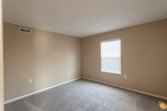 This is a photo of the second bedroom in the 890 square foot 2 bedroom, 1 bath Liberty (lower) at Washington Place Apartments in Miamisburg, Ohio in Washington Township.